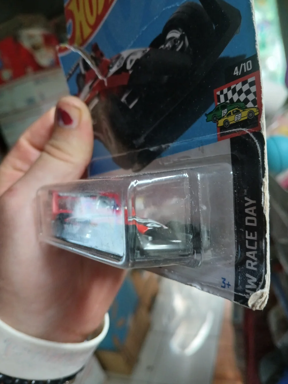 1:64 scale red and black HW-4-TRAC die-cast car from the 2024 Hot Wheels HW Race